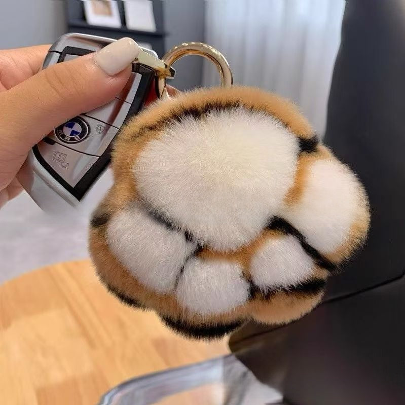 Llavero de peluche con forma de patita de gato