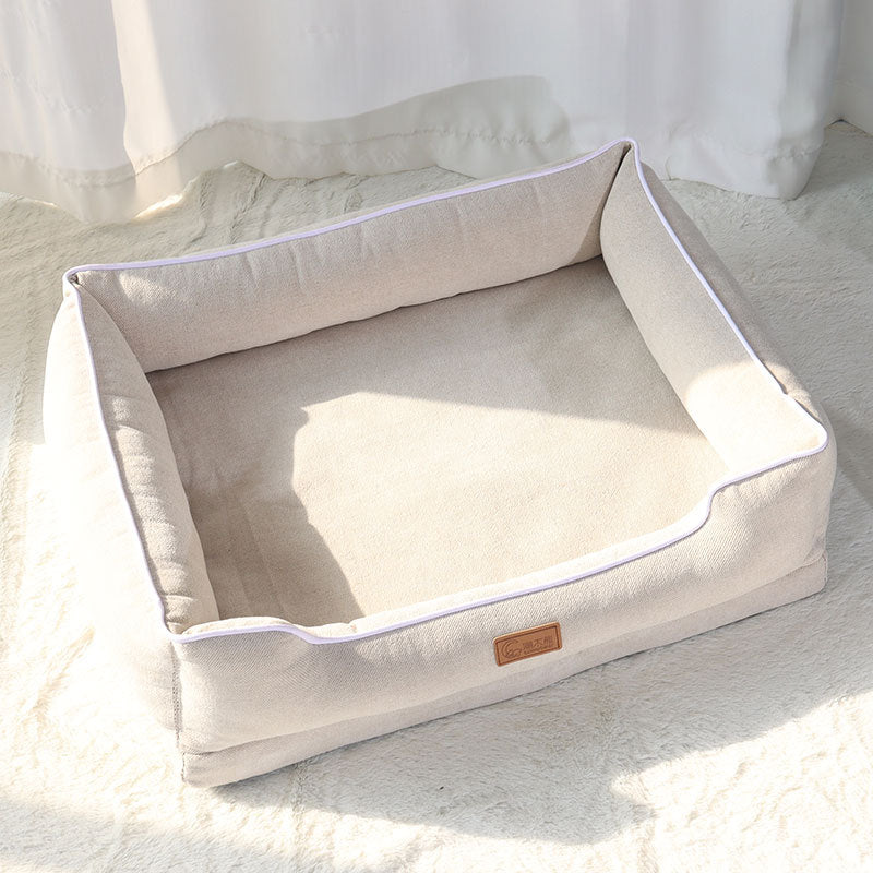 Cama tipo sofá acolchada para perros