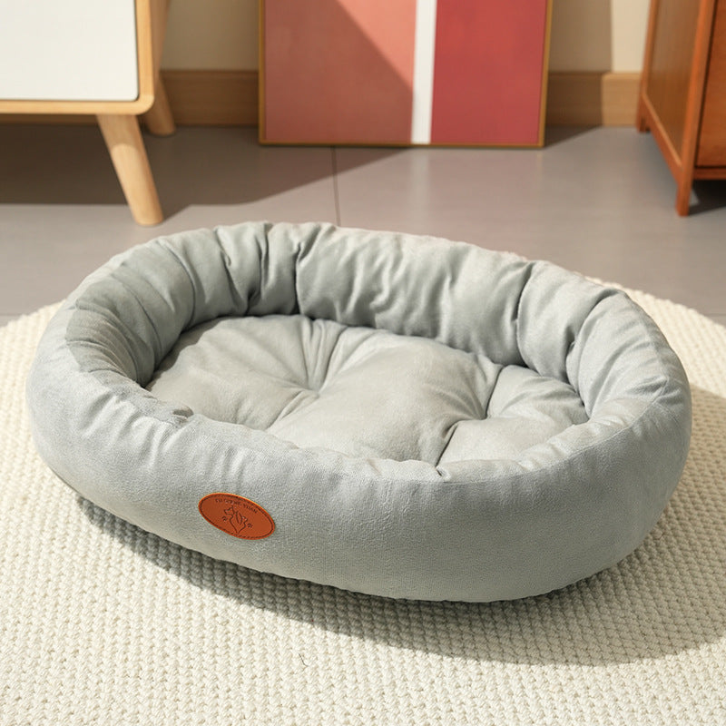 Cama ovalada transpirable para perros y gatos