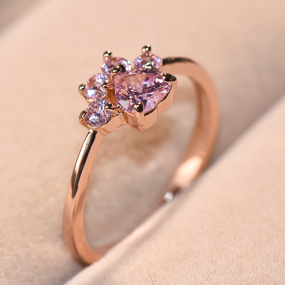 Anillo ajustable con huella de gato y circonitas