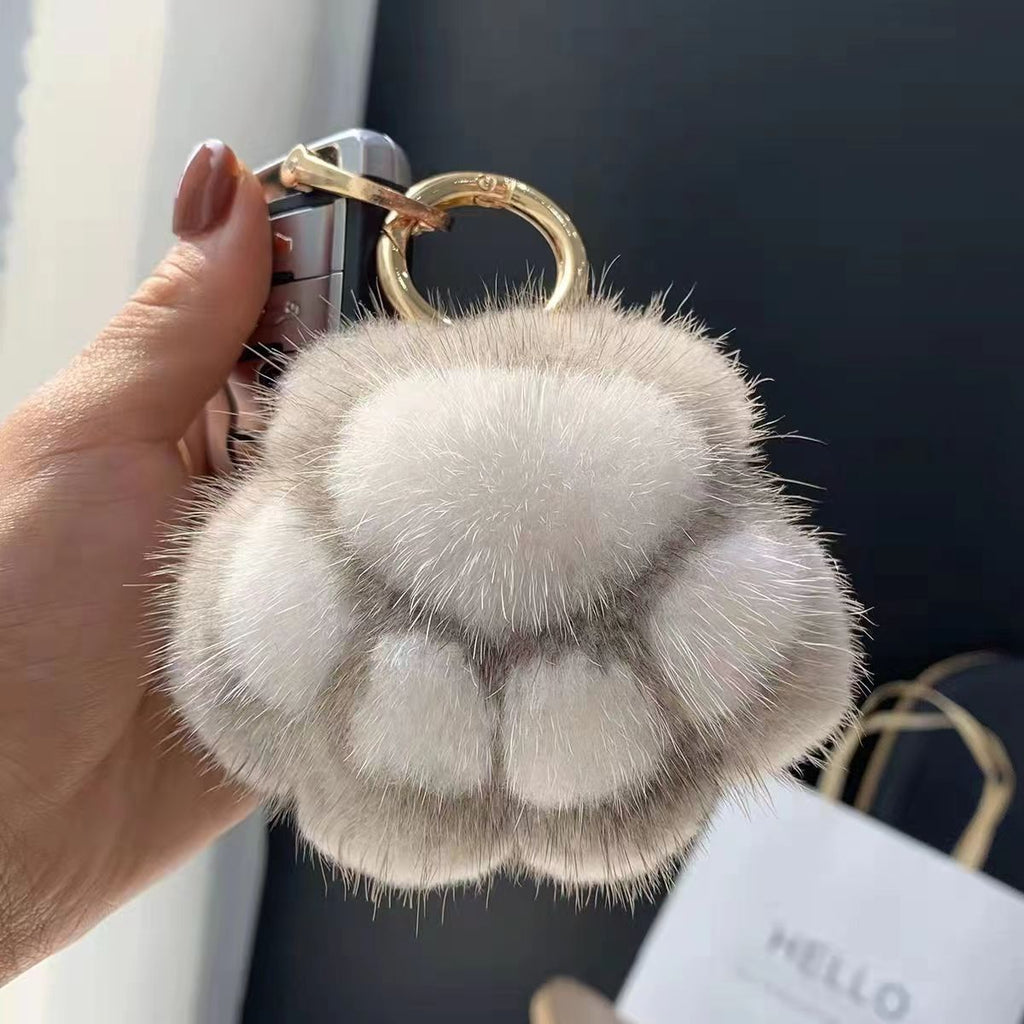 Llavero de peluche con forma de patita de gato