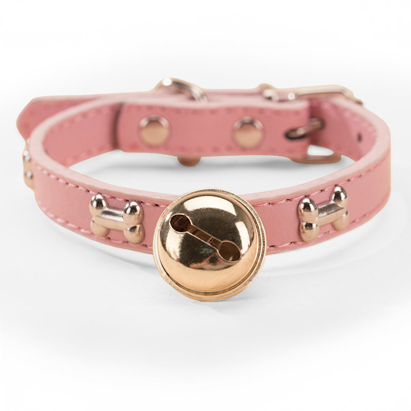 Cascabel con huella y hueso para collar de mascota en color rosa