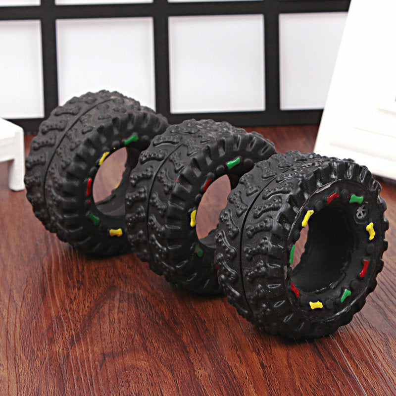 Juguete de goma con forma de rueda y sonido para perros