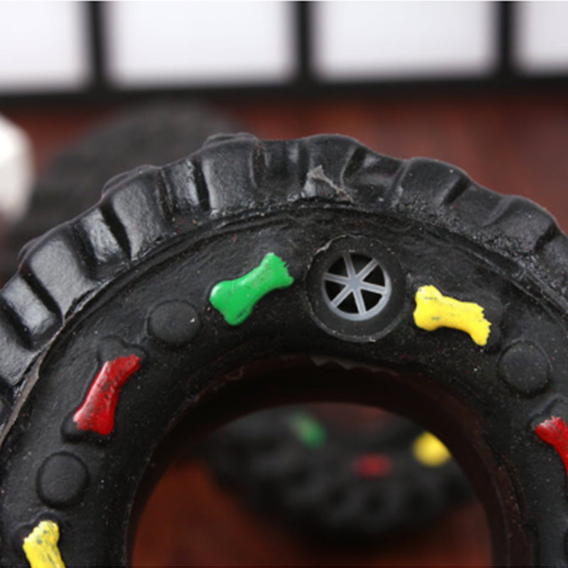 Juguete de goma con forma de rueda y sonido para perros