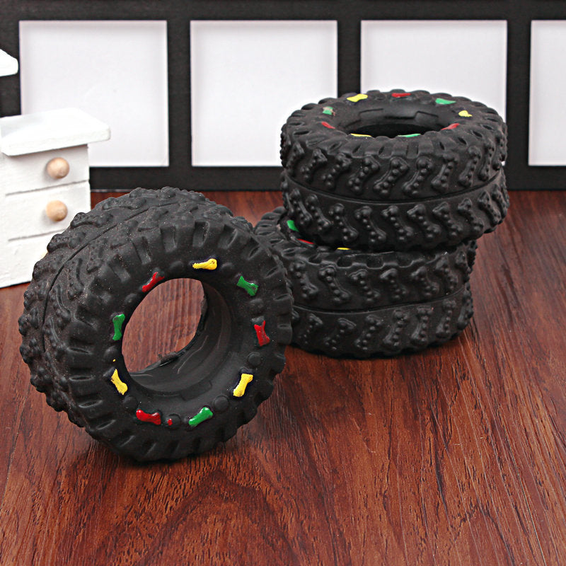 Juguete de goma con forma de rueda y sonido para perros