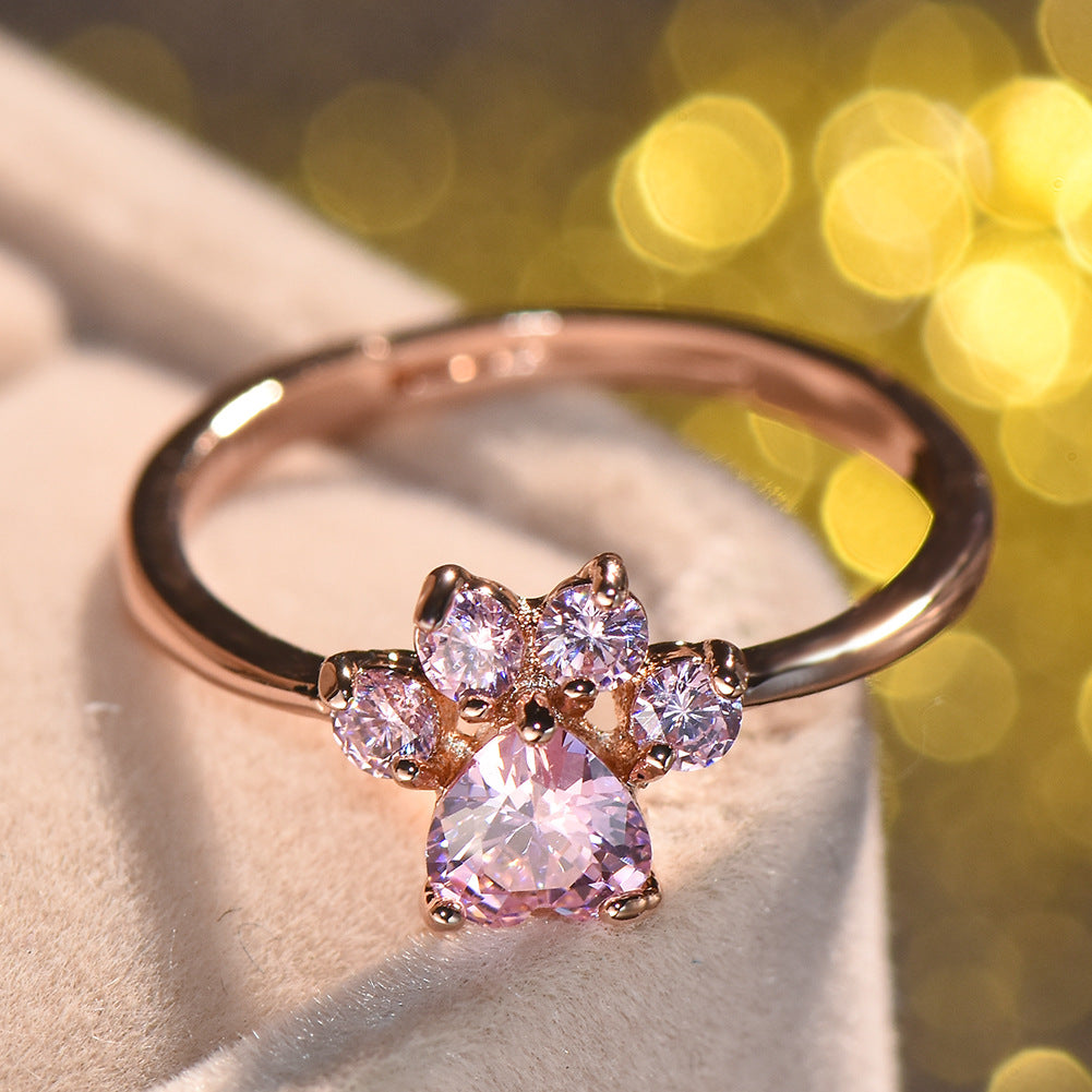 Anillo ajustable con huella de gato y circonitas