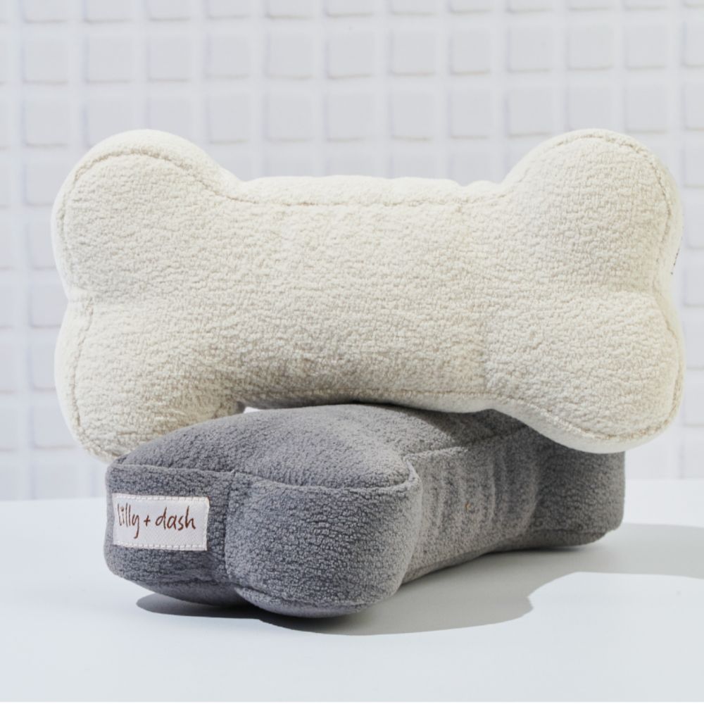 Juguete de hueso de bouclé con sonidos para perros
