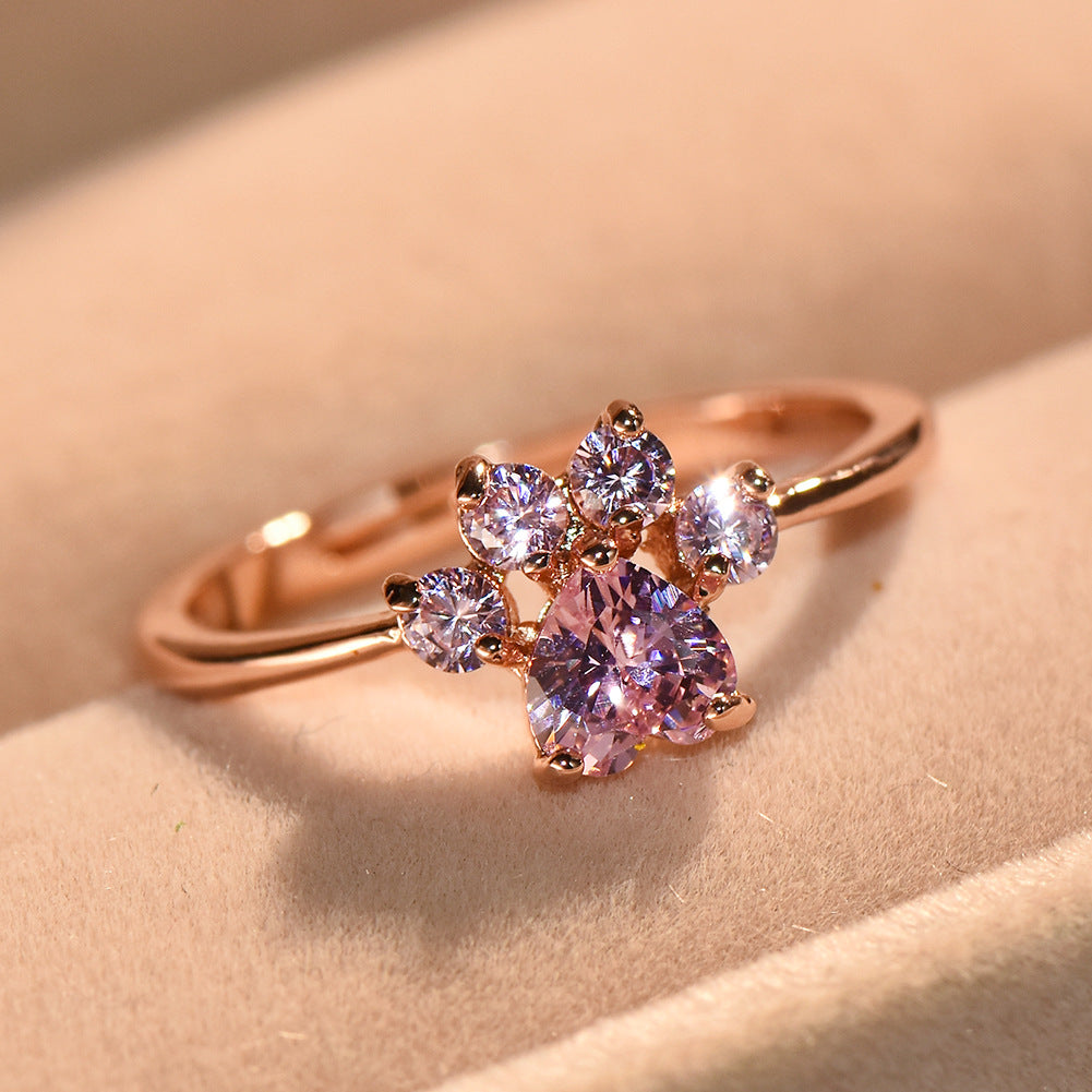 Anillo ajustable con huella de gato y circonitas