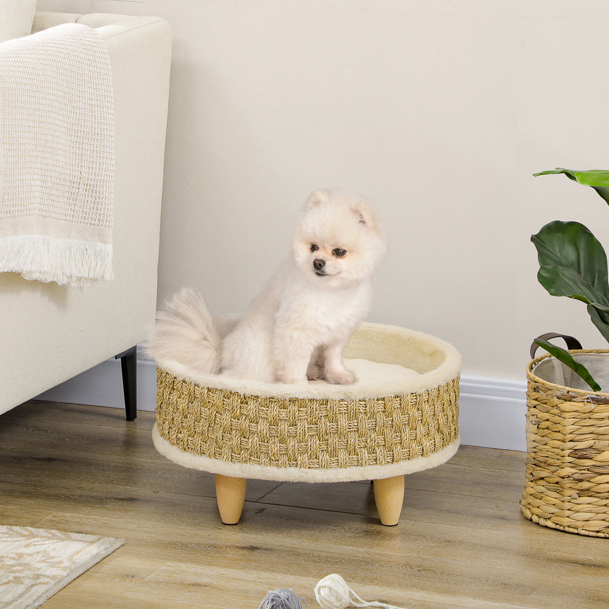 Cama redonda elevada para perros y gatos con cojín beige